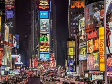 Times Square billboards with ads.