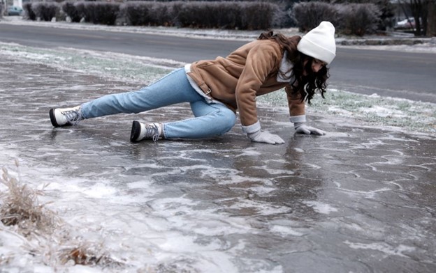 Woman in a slip and fall accident on ice.