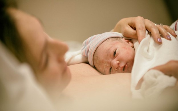 Mom with her newborn child, birth injuries.