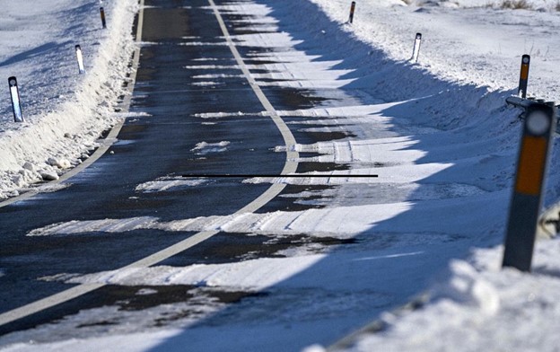 Black ice on a road.